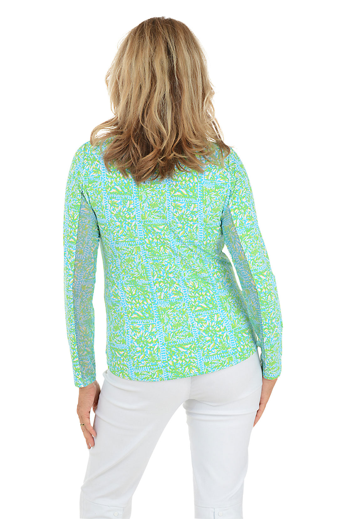 Woman wearing a green and blue patterned long-sleeve shirt on a white background. Back shot.