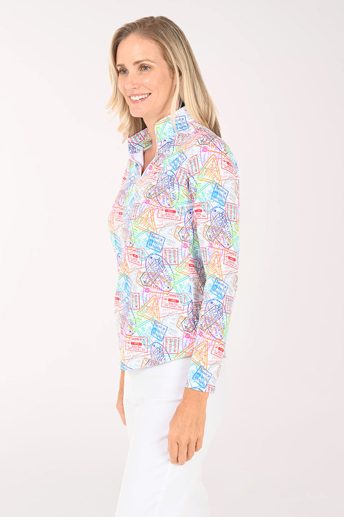 Woman wearing a colorful patterned blouse on a white background