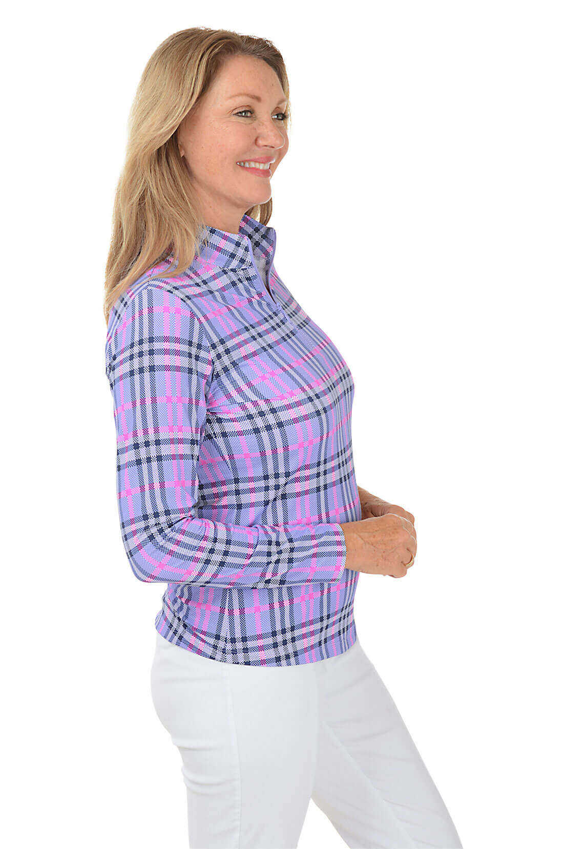 A woman wearing a long sleeve plaid sun shirt with a mock neck collar in a purple, pink, and white check pattern. Side shot.
