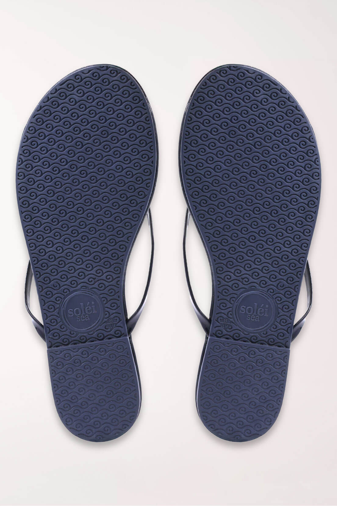 Navy blue insole with textured surface on a white background