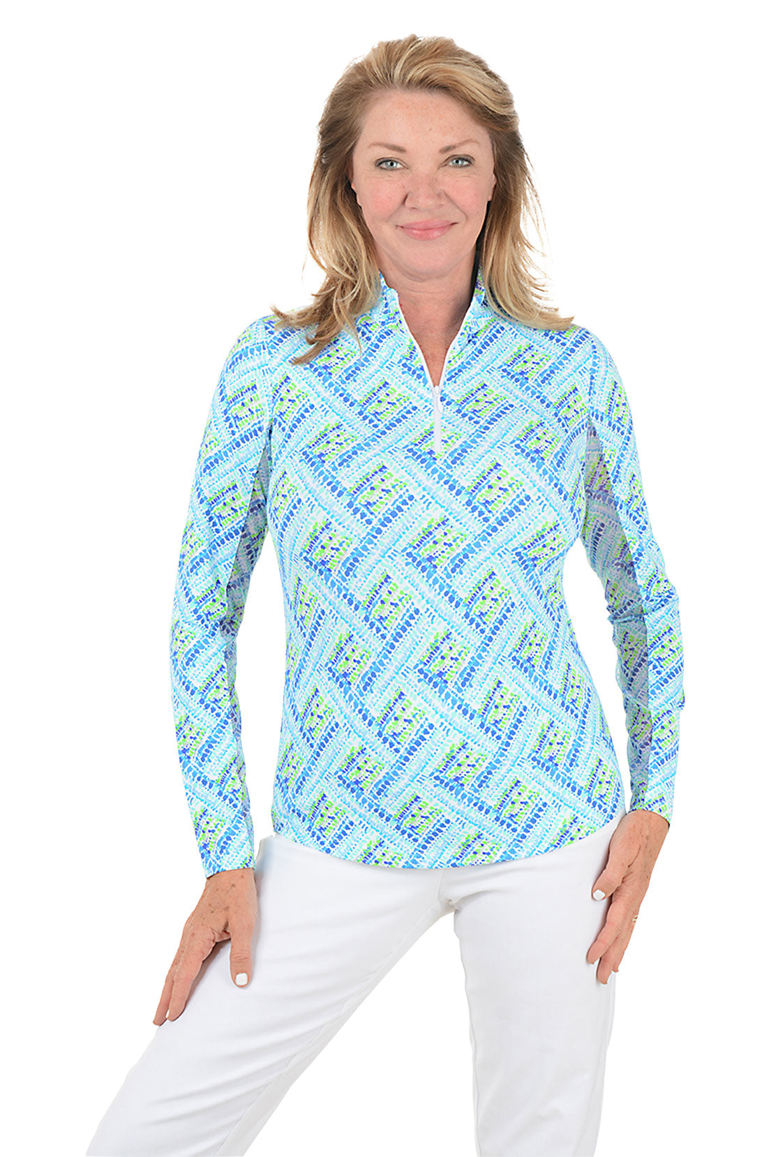 Woman wearing a blue patterned long-sleeve shirt on a white background.