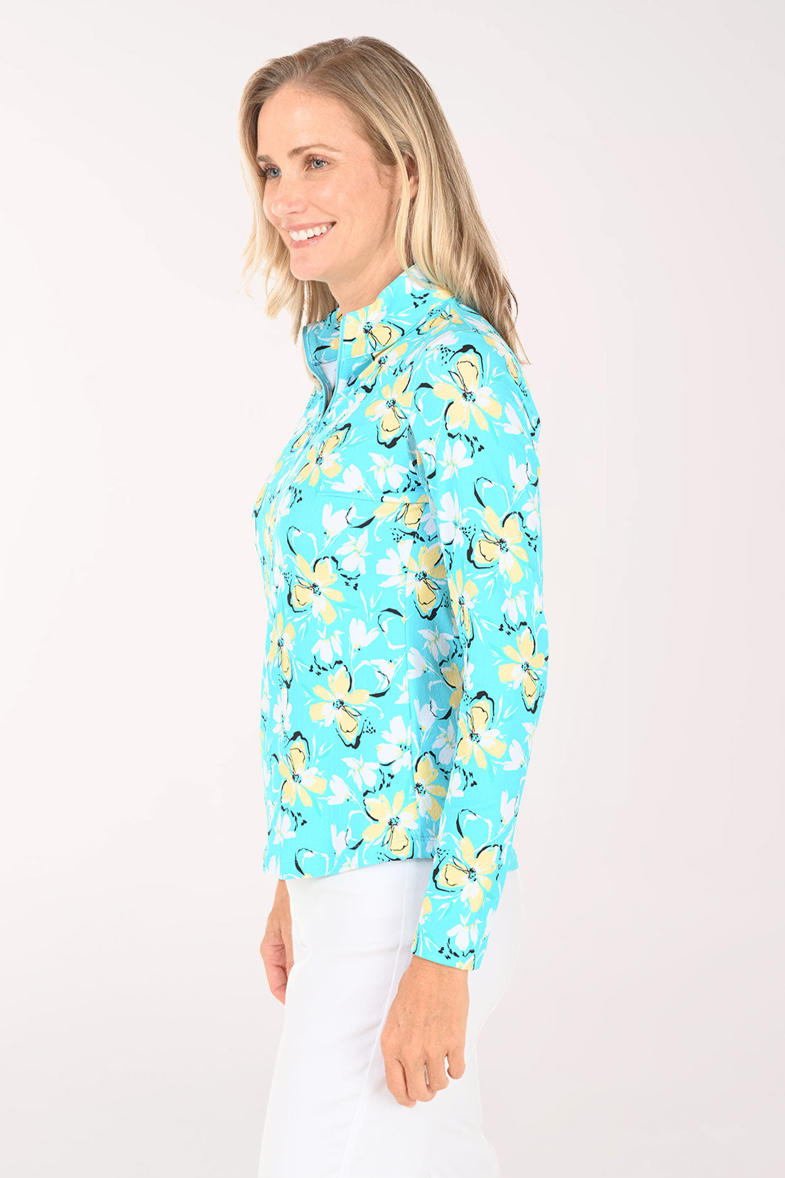 Woman wearing a blue floral patterned shirt on a white background