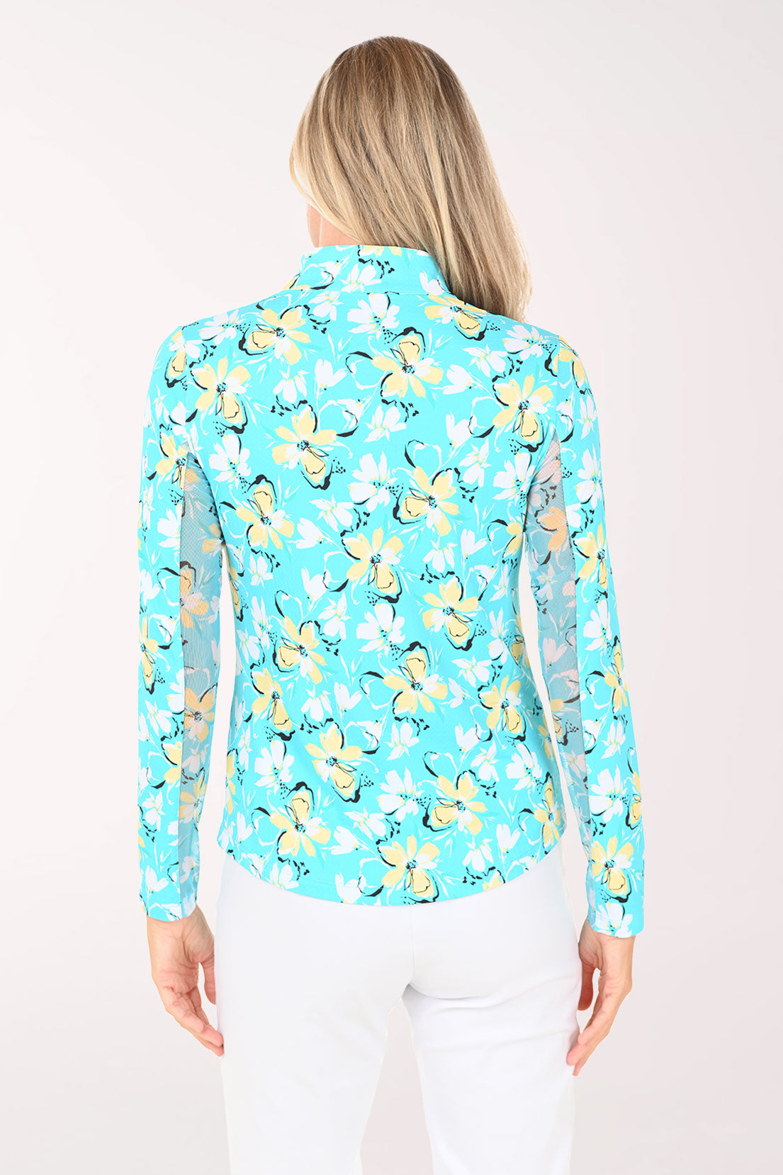 Woman wearing a blue floral patterned shirt on a white background