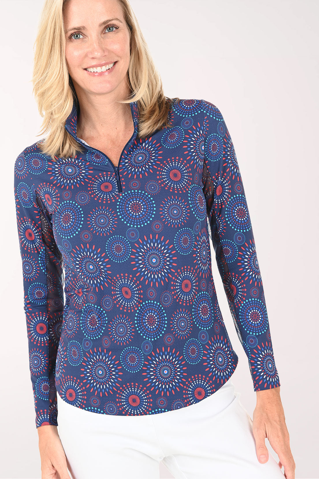Woman wearing a blue patterned long-sleeve shirt on a white background