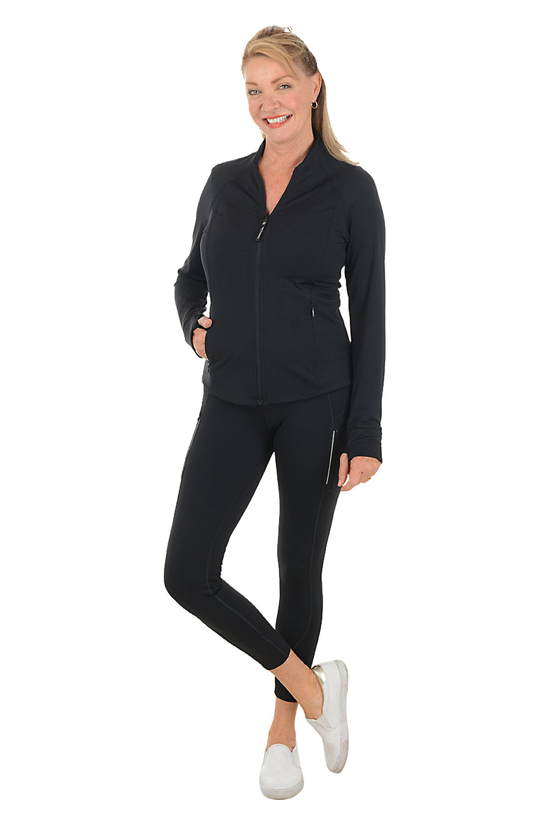 Woman wearing a black outfit with a white background