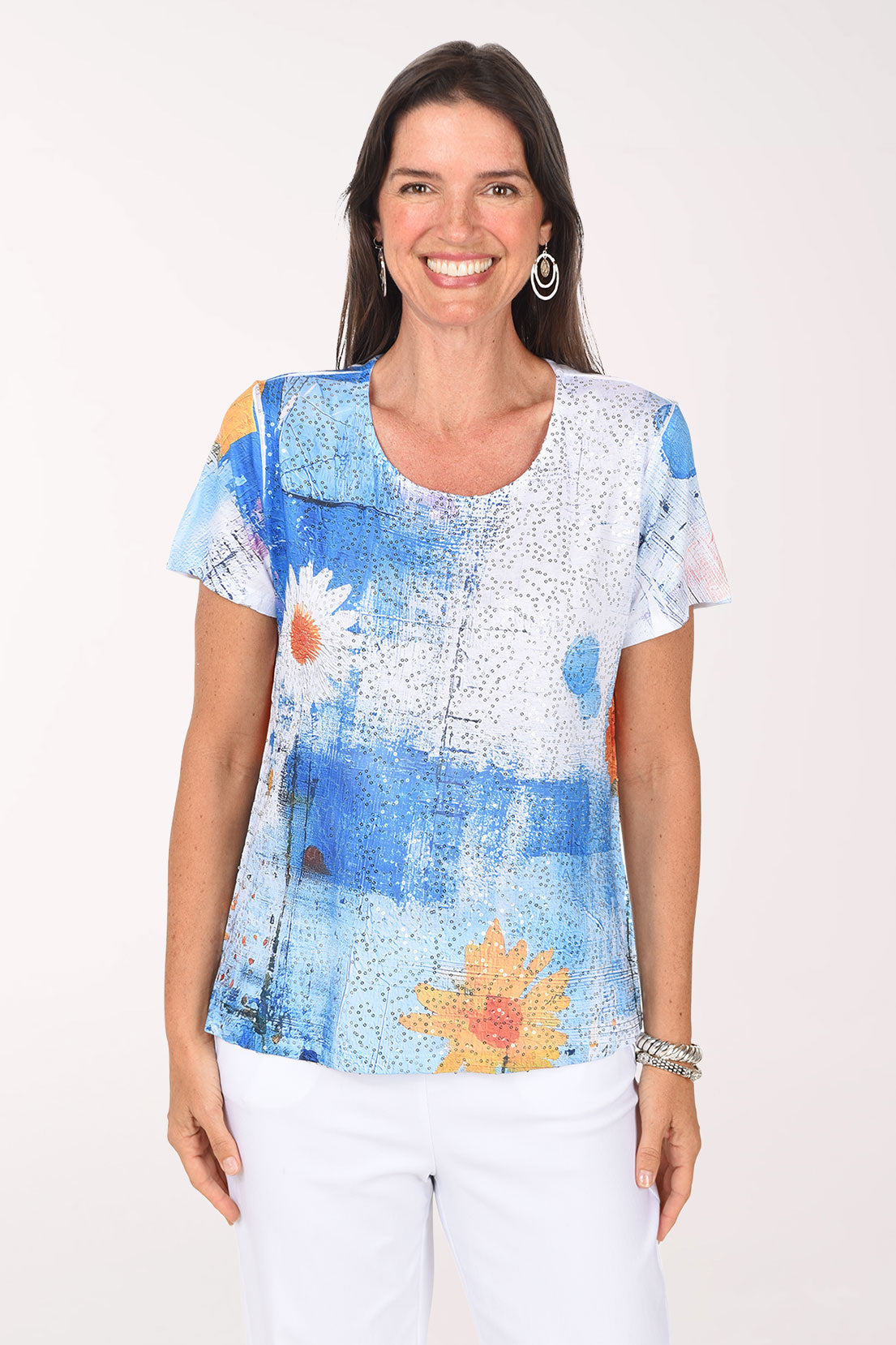 Model wearing the Impulse Daisy Blues Sequined Tee, a cobalt and sky blue painterly print with white daisies, front view