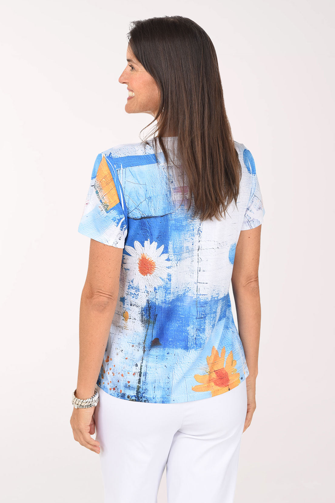 Back view of the Daisy Blues Sequined Tee in blue painterly print with a white daisy
