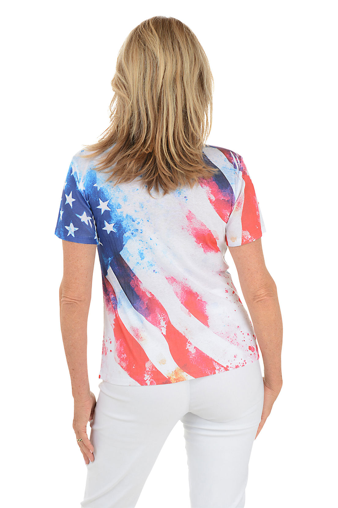 Woman wearing a colorful abstract patterned top on a white background