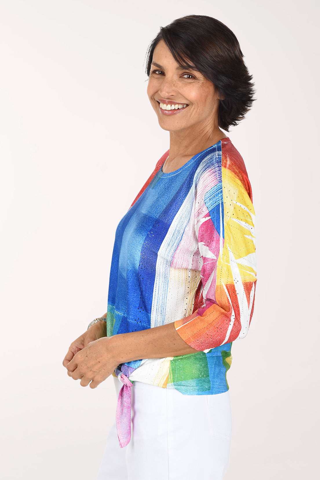 Side view showing the drop shoulder and bright color blocks across the sleeve