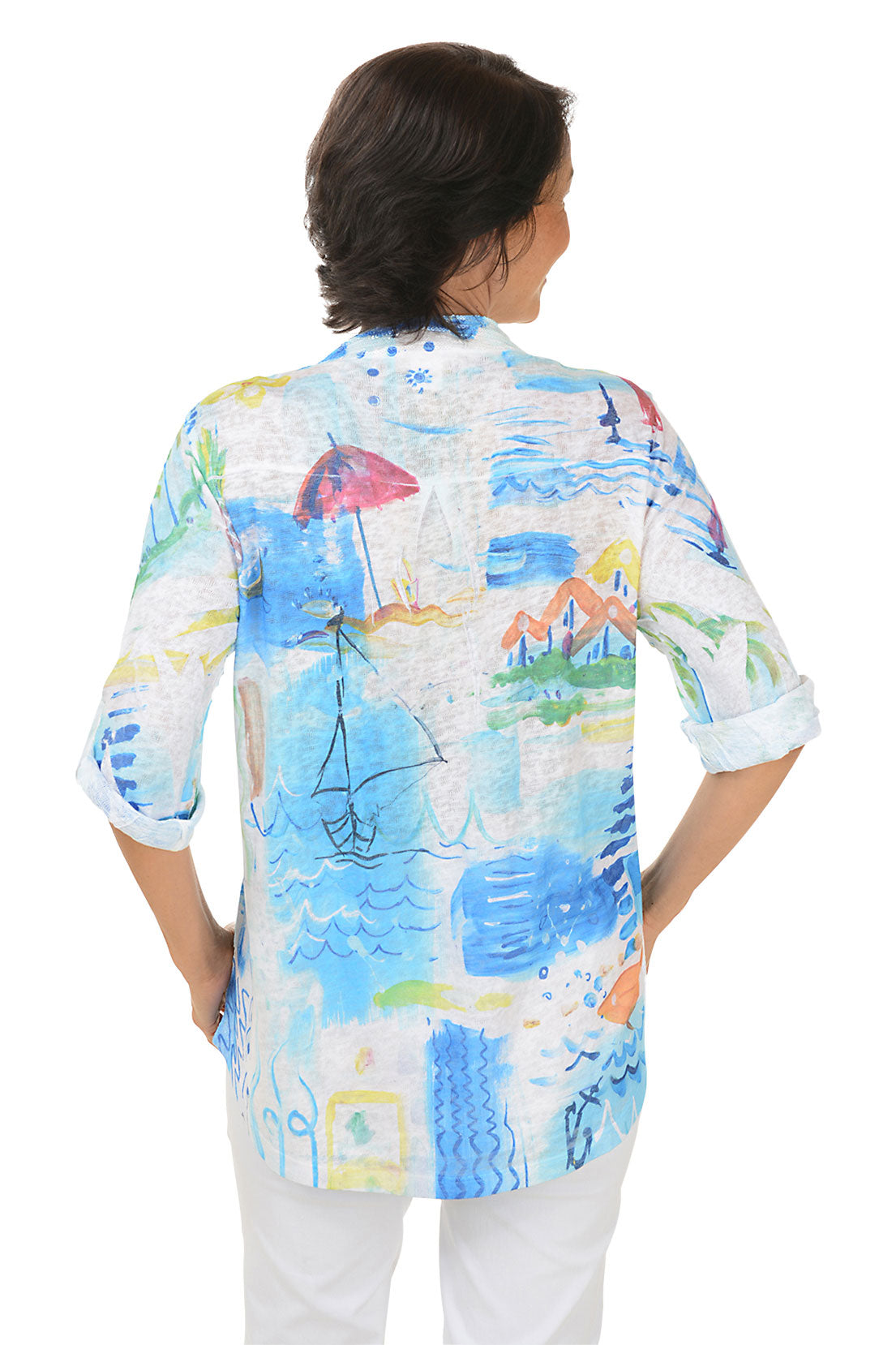 Woman wearing a colorful beach patterned blouse on a white background. Back shot.