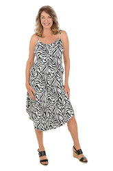 A woman wearing a black and white sleeveless cover-up dress.