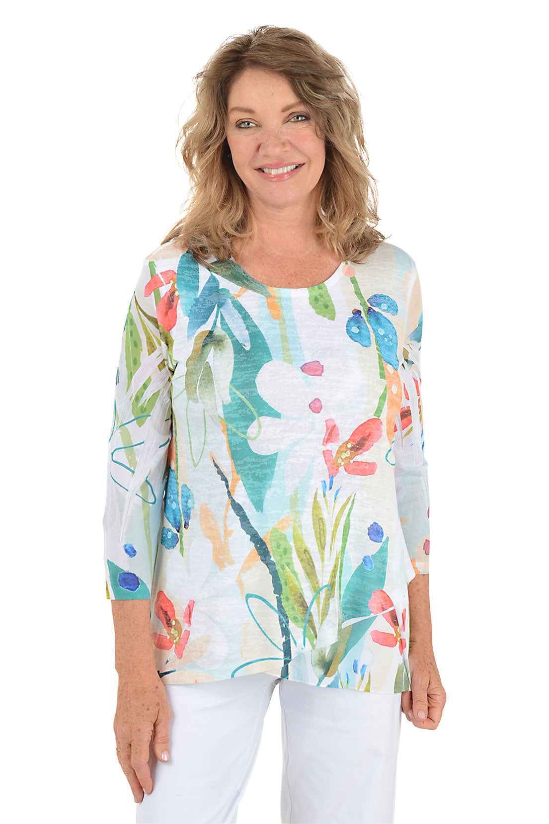 A woman wearing a white 3/4 sleeve abstract floral shirt.