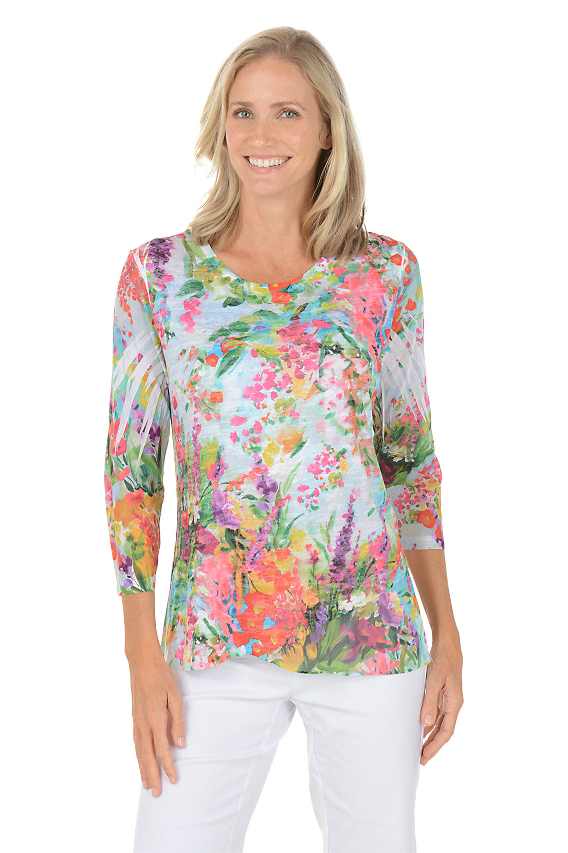 A woman wearing a floral patterned 3/4 sleeve top.