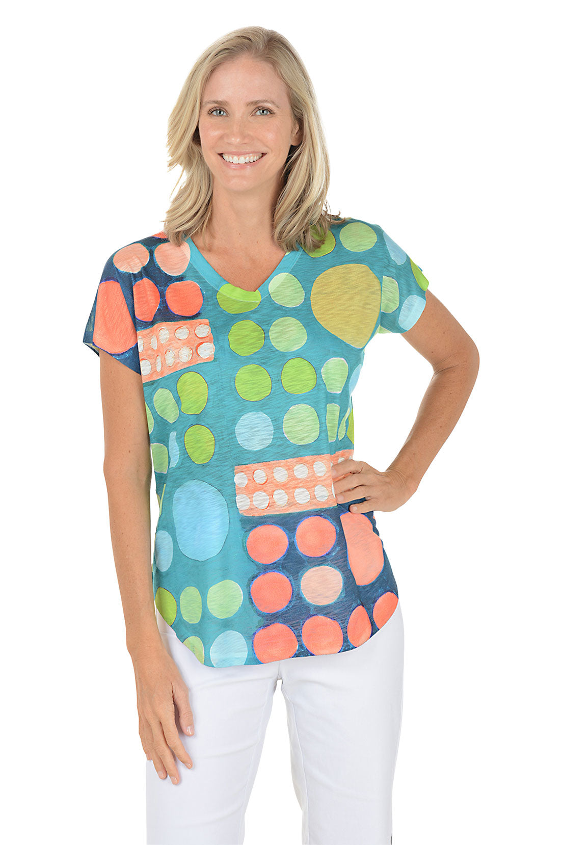 A woman wearing a multi-colored short sleeve v-neck shirt with a dot design.