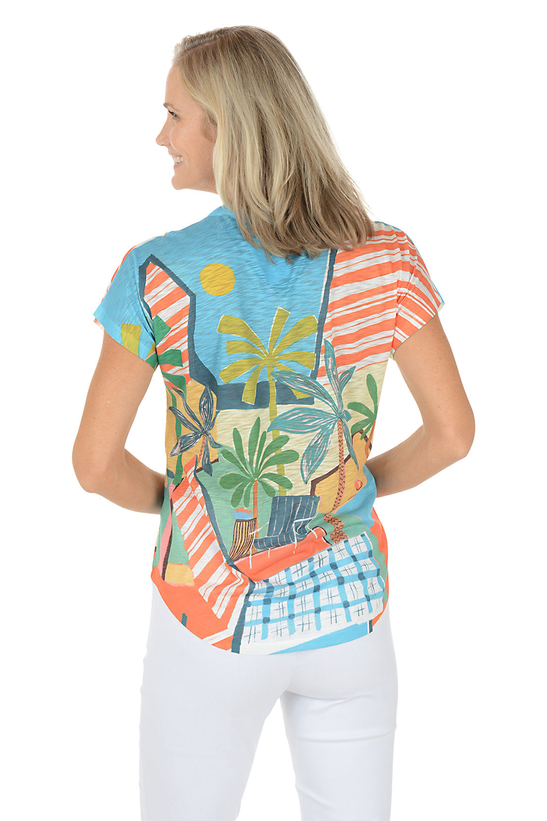 A woman wearing a multicolored short sleeve v-neck shirt with a landscape design. Back shot.