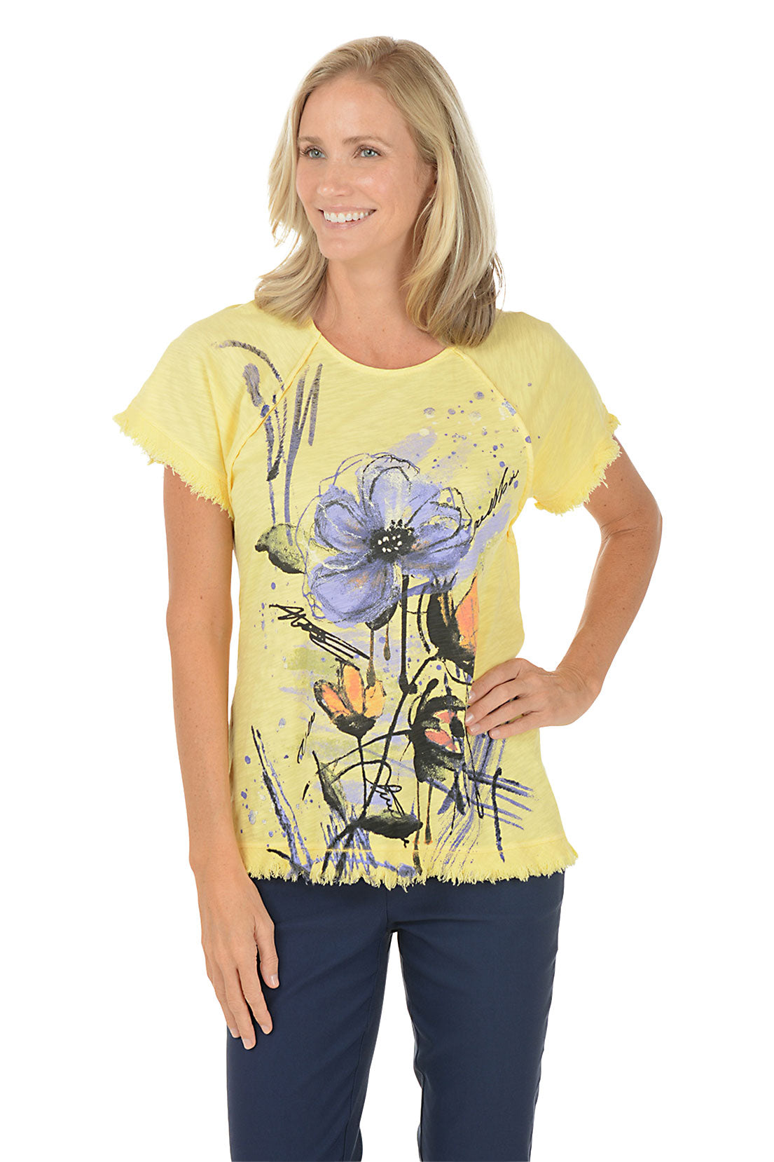 A woman wearing a short sleeve yellow shirt with a floral pattern. Second front shot.