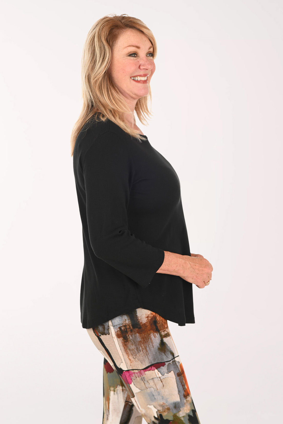 Woman wearing a black 3/4 sleeve top