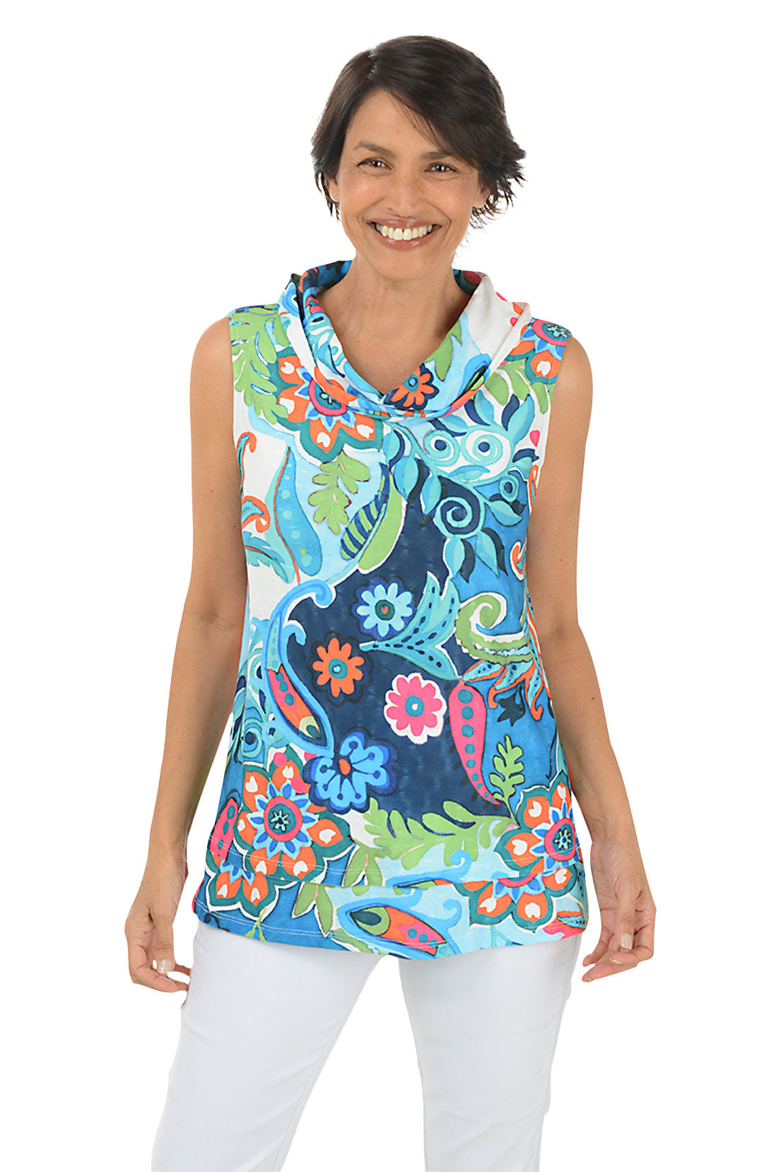 A front shot of a model wearing a sleeveless floral print top with a cowl neckline, showcased on a model wearing white pants.