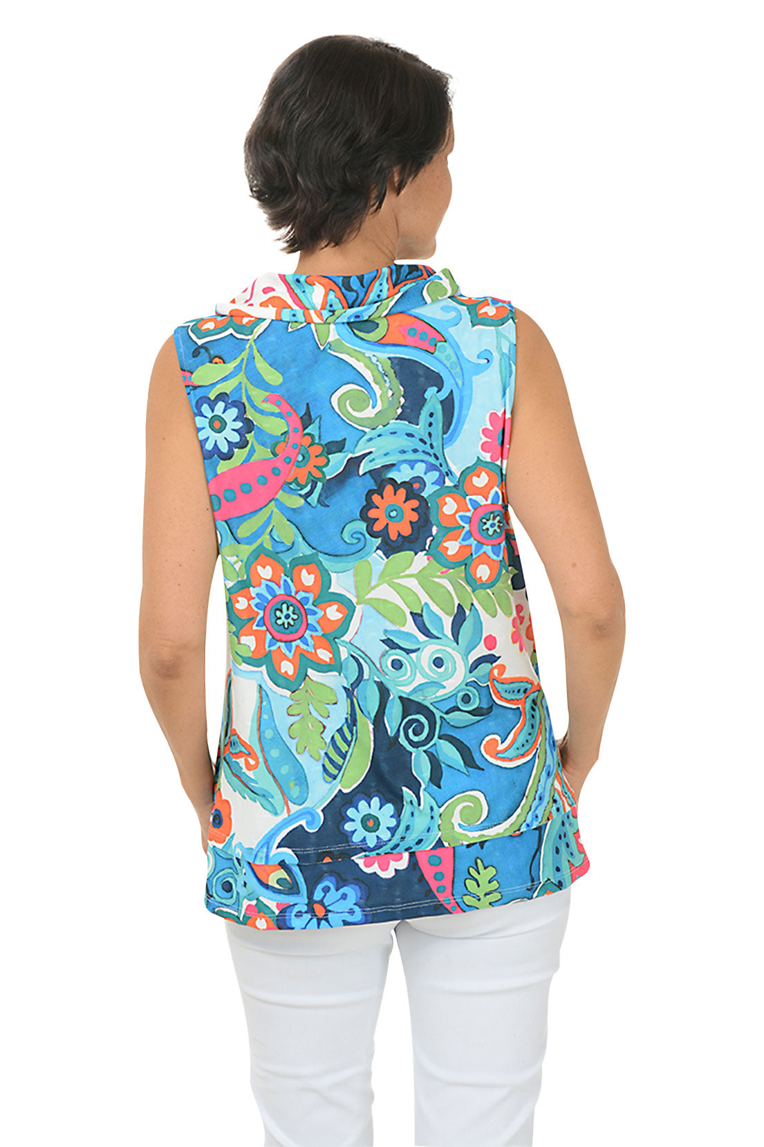 A back shot of a model wearing a sleeveless floral print top with a cowl neckline, showcased on a model wearing white pants.