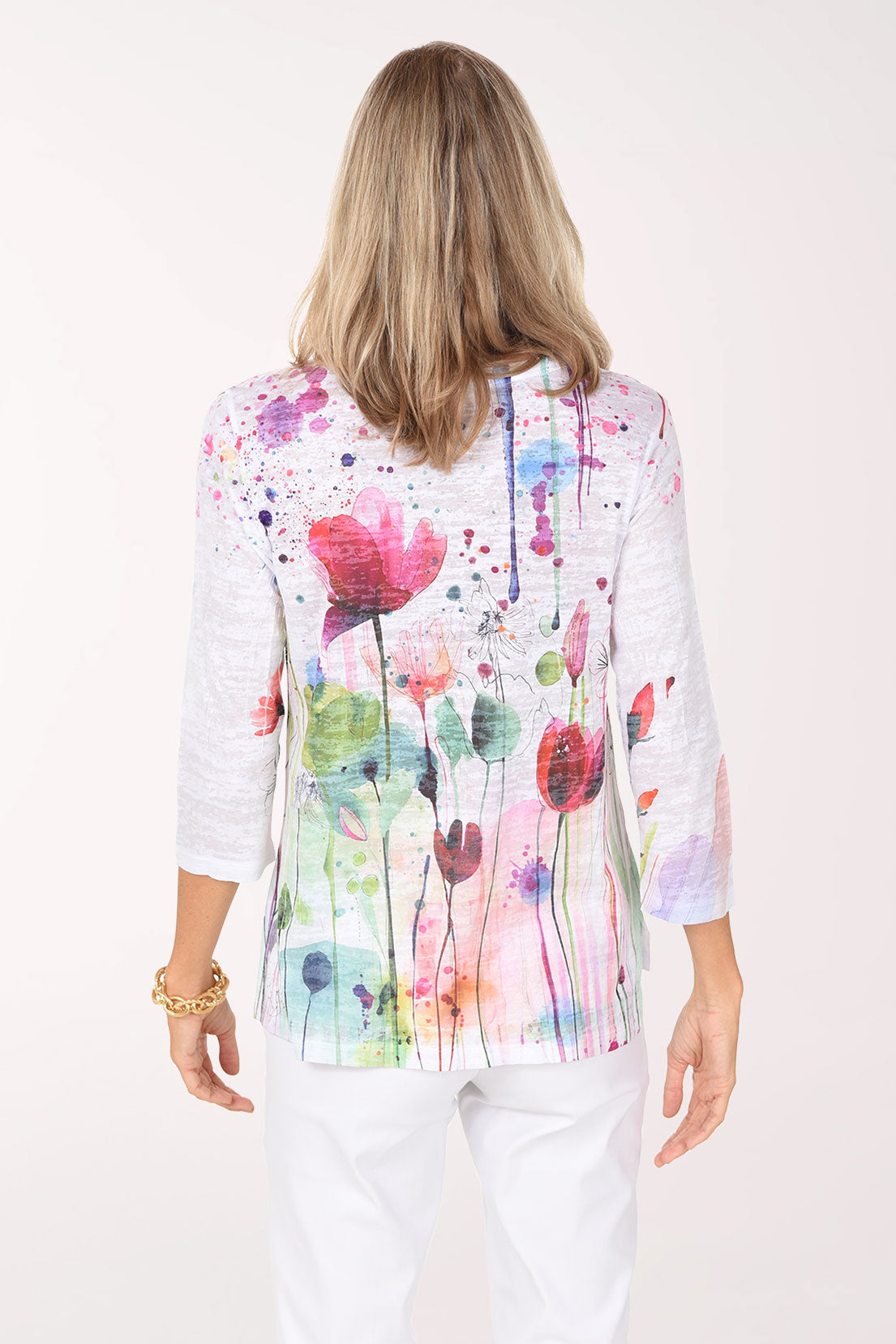 Back view of the Primavera Burnout High-Low Knit Top in poppy print