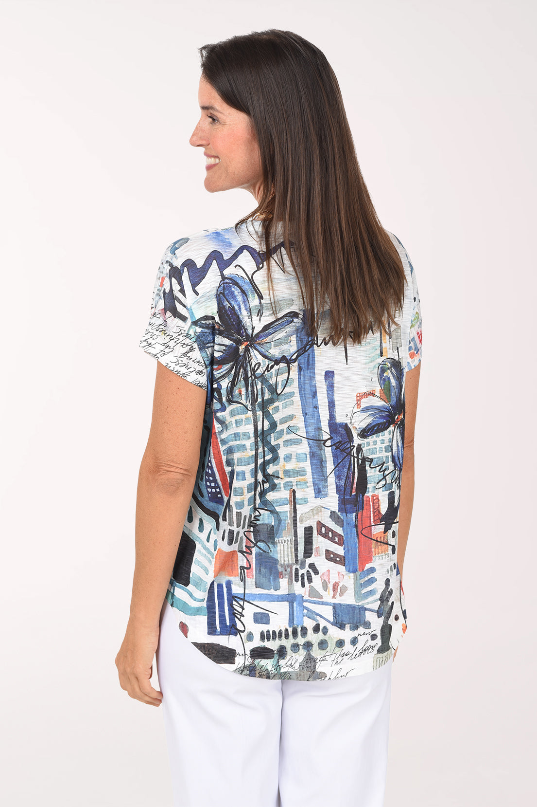 Back view of the Brooklyn Slub Knit Short Sleeve Top in navy and teal collage print
