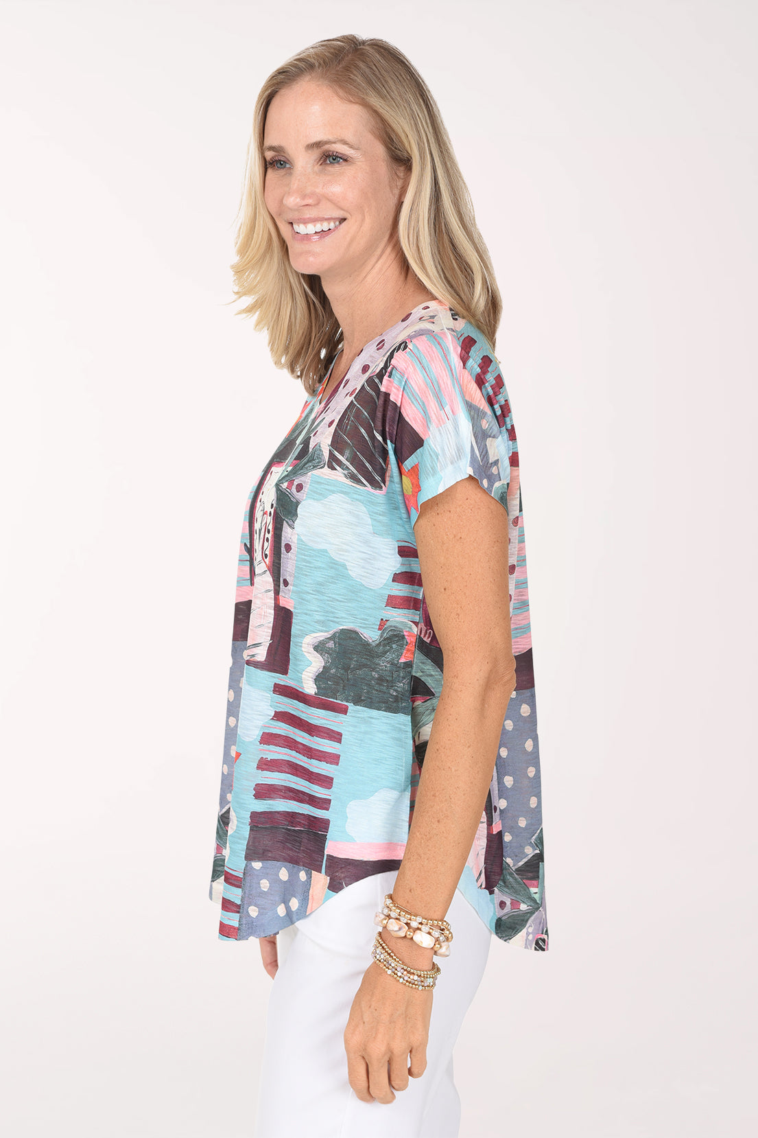 Side view of the Sunny Day Slub Knit Short Sleeve Top with the curved hem
