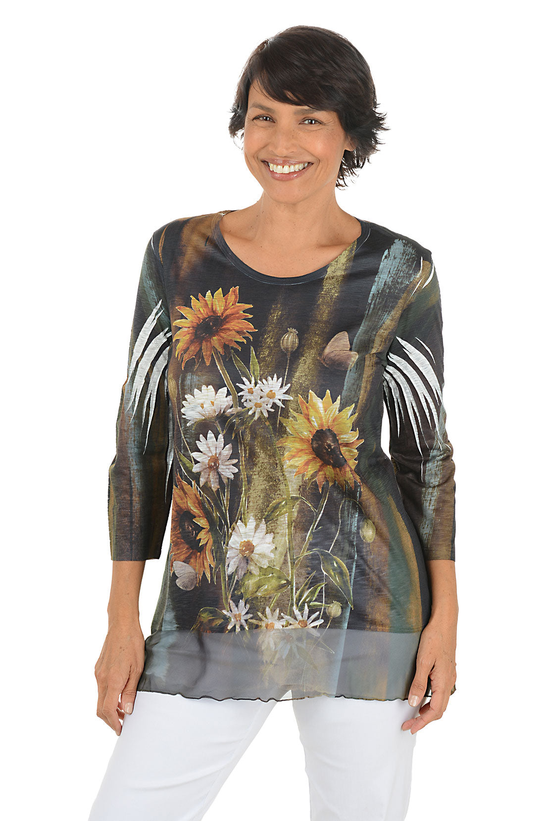 A front shot of a model wearing a floral print top with sunflowers and white flowers on a plain background.