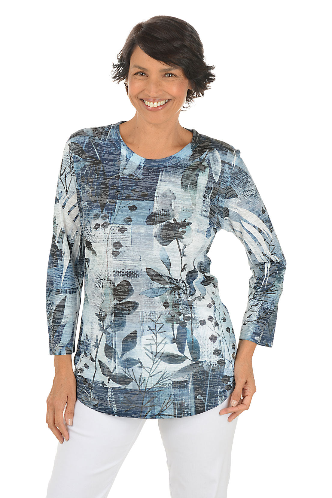 A front shot of a model wearing a blue floral patterned top on a white background