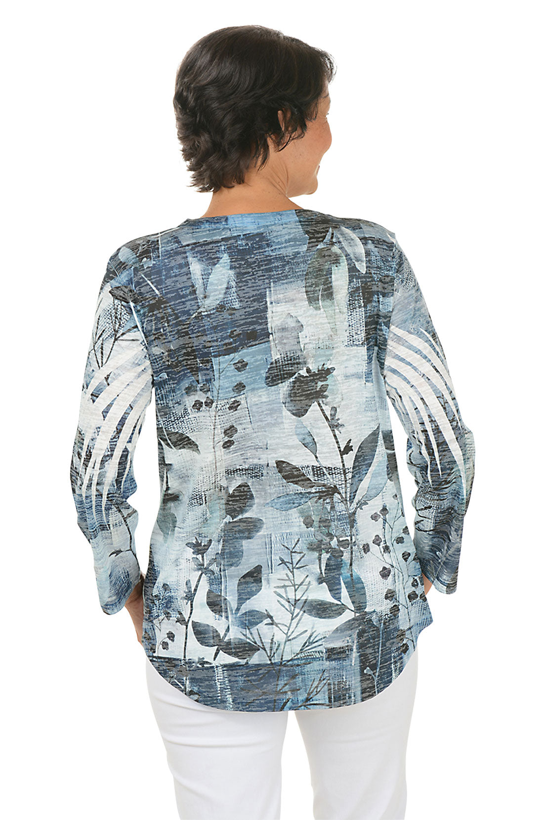 A back shot of a model wearing a blue floral patterned top on a white background