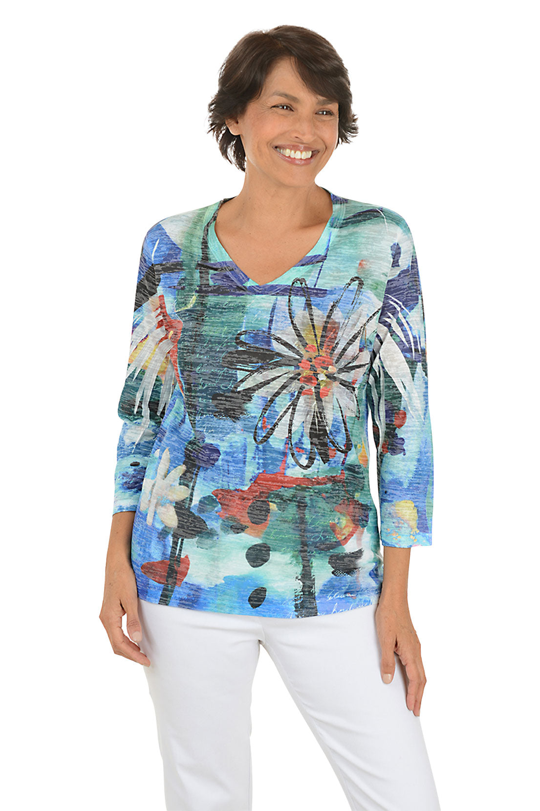 A front shot of a model wearing a colorful floral-patterned top on a white background