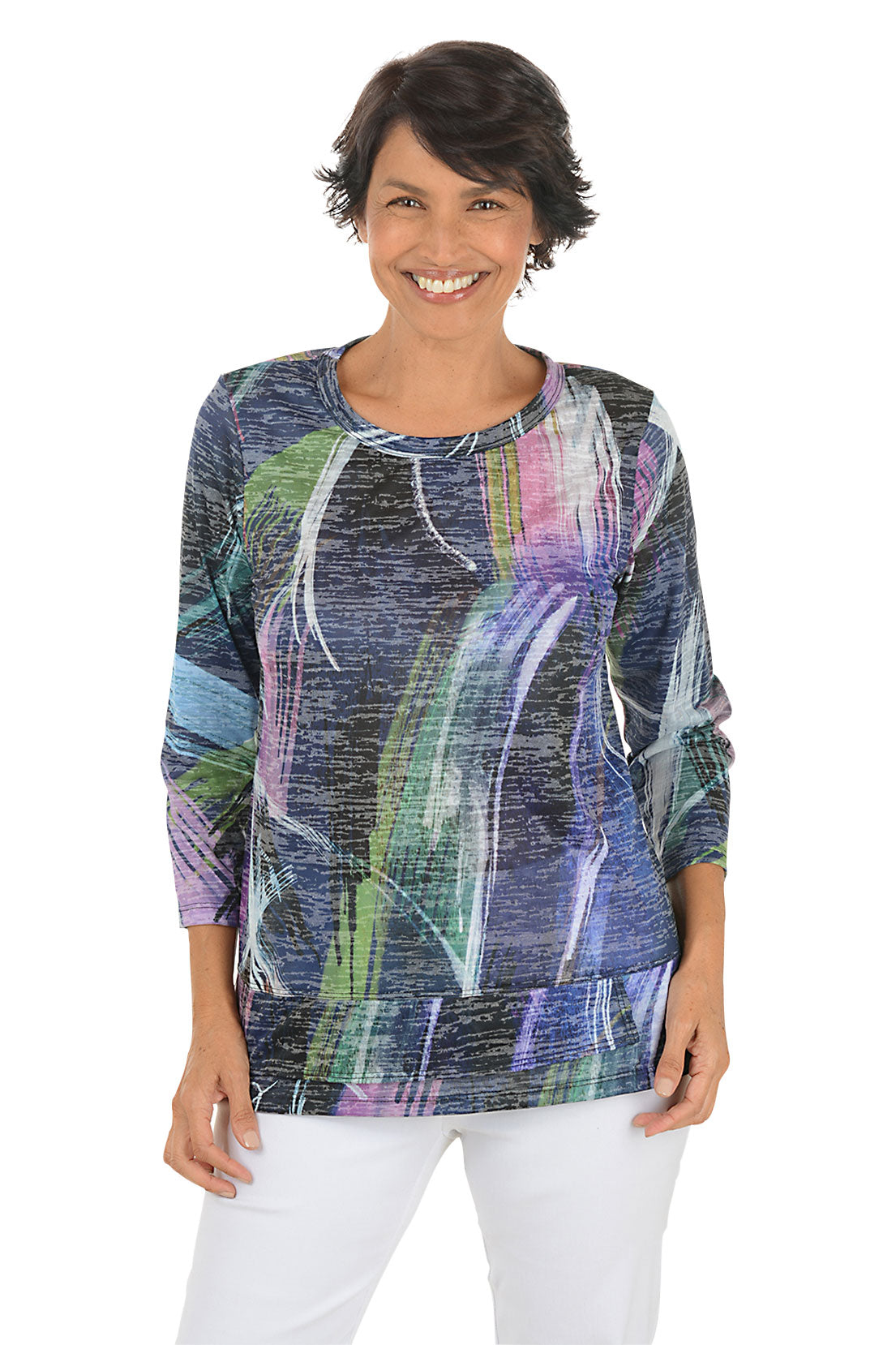 A front shot of a model wearing a colorful abstract patterned top on a white background