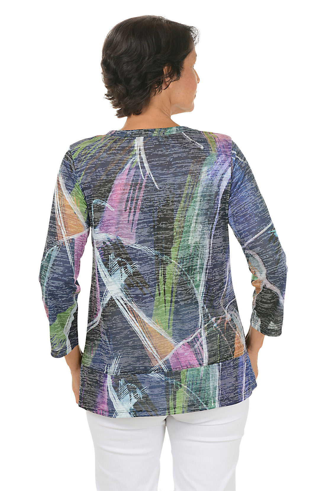 A back shot of a model wearing a colorful abstract patterned top on a white background