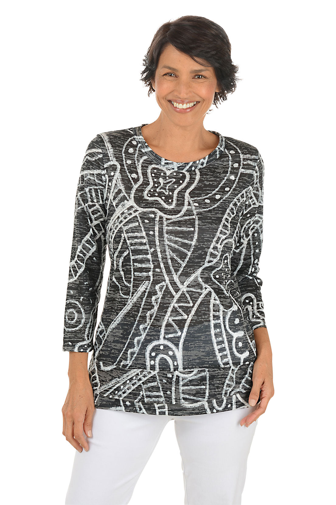 A front shot of a model wearing a black and white patterned top on a white background