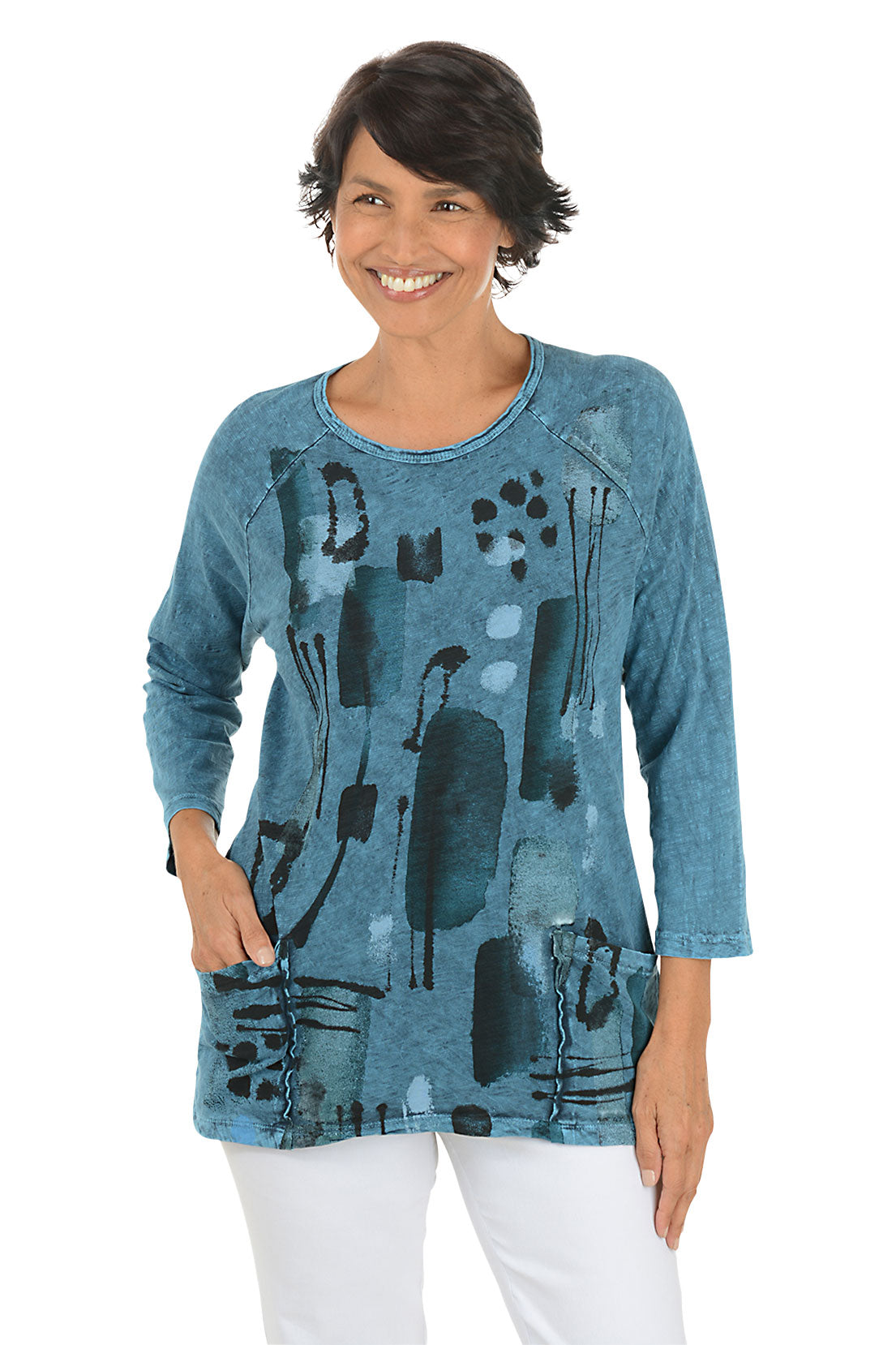 A front shot of a model wearing a blue abstract patterned top on a white background