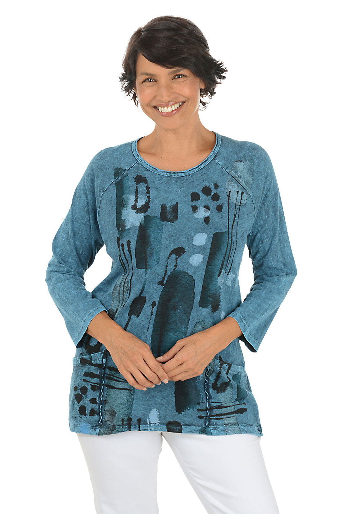 A front shot of a model wearing a blue abstract patterned top on a white background