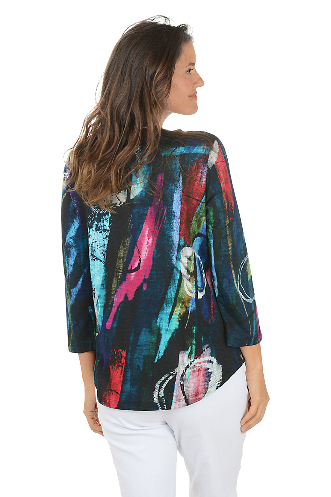 Woman wearing a colorful abstract patterned top on a white background. Back shot.