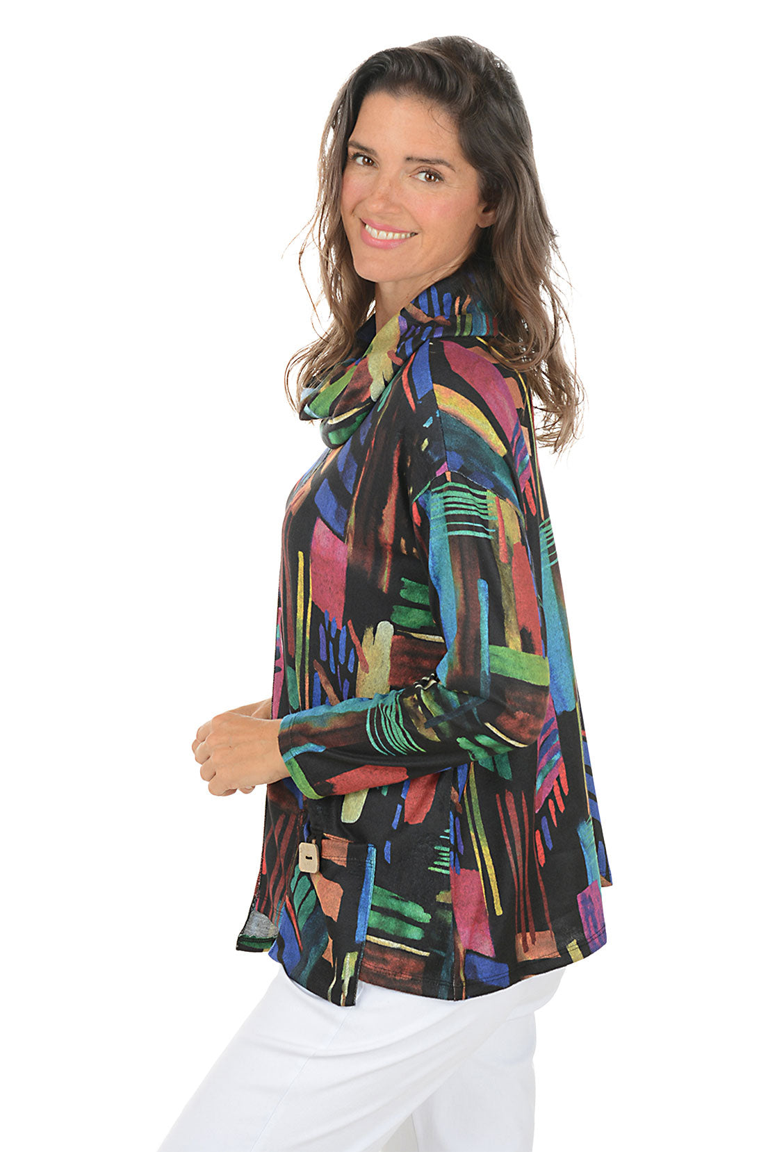 Woman wearing a colorful patterned top on a white background. Side shot.