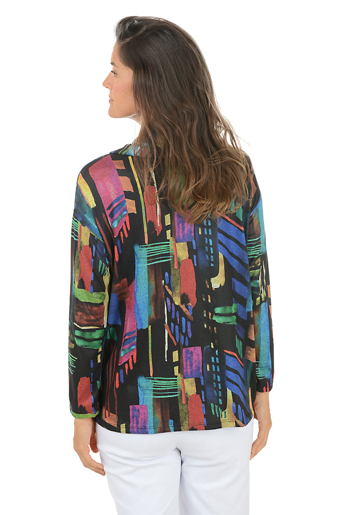 Woman wearing a colorful patterned top on a white background. Back shot.