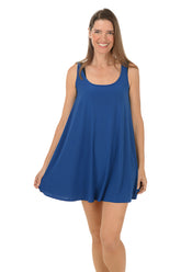 A front shot of a model wearing a royal blue sleeveless swing silhouette dress with a scoop neckline.