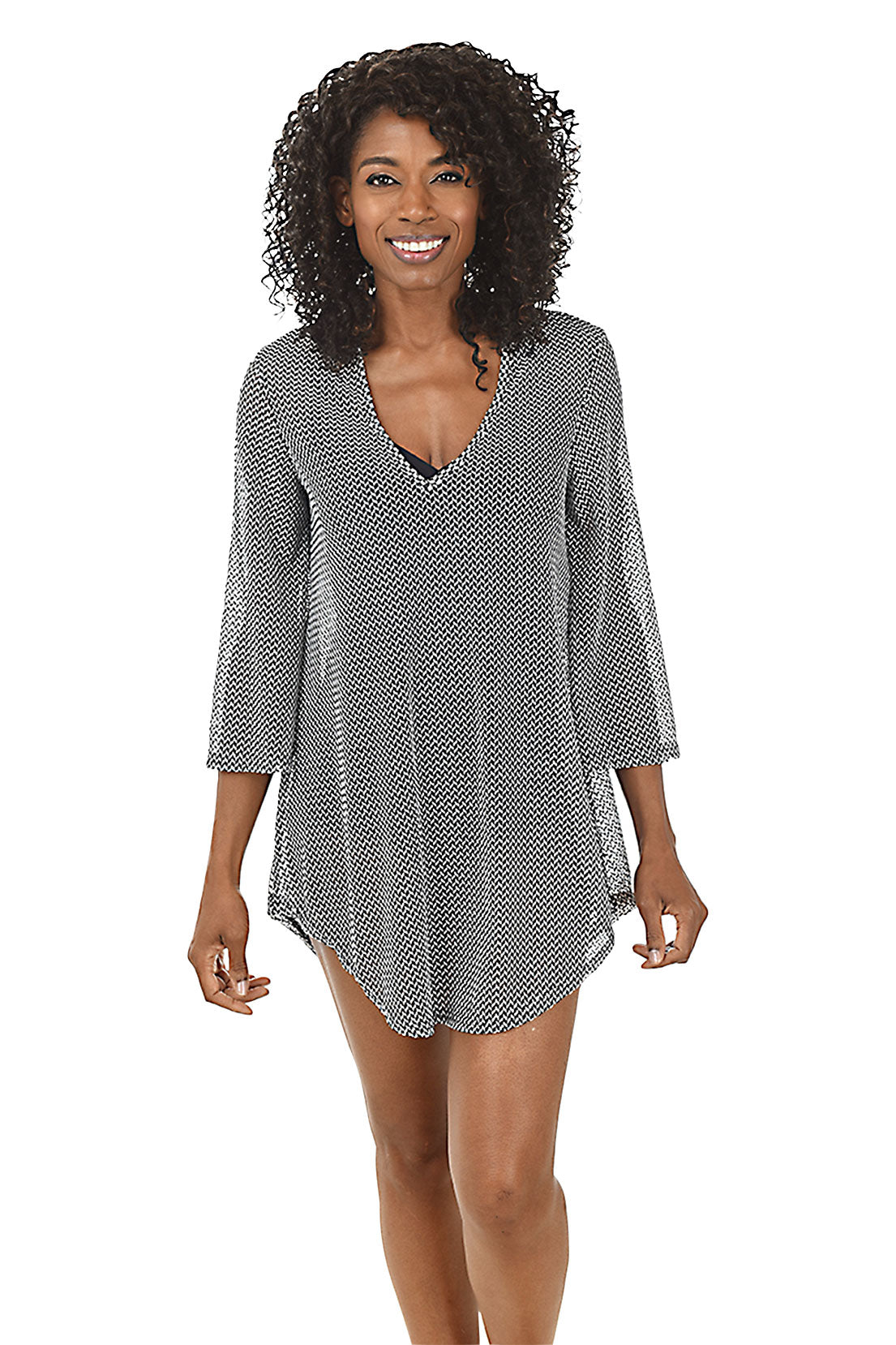 A front shot of a model wearing a black white chevron mesh tunic cover-up with 3/4 bell sleeves and a V-neck.