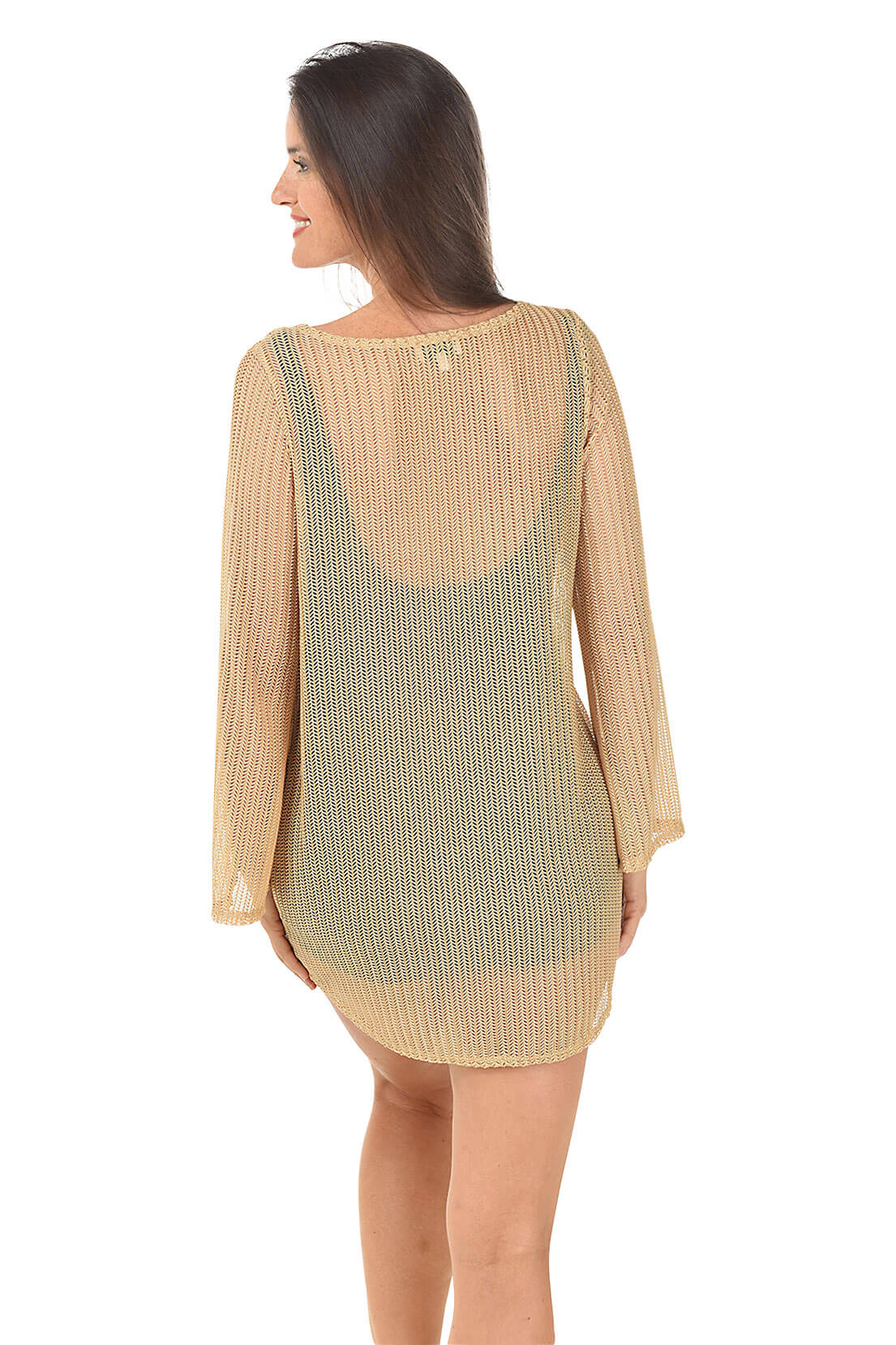 Woman wearing a beige long-sleeve dress with a patterned overlay on a white background. Back shot.