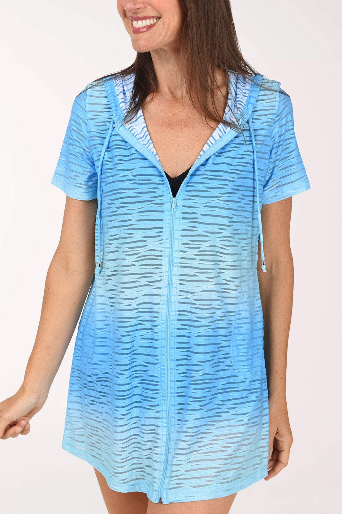 A close view of the aqua ombre wave mesh zip hoodie cover-up showing the zip front and short sleeves.