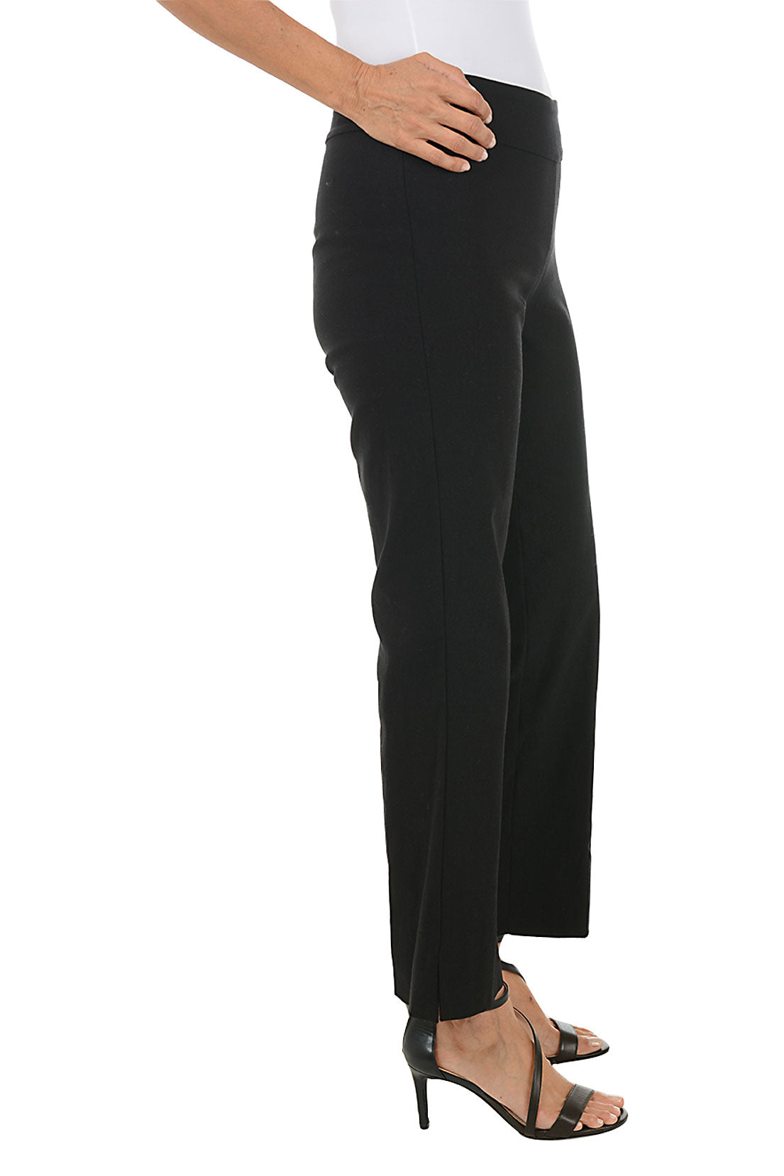 Person wearing black pants on a white background. Side shot.
