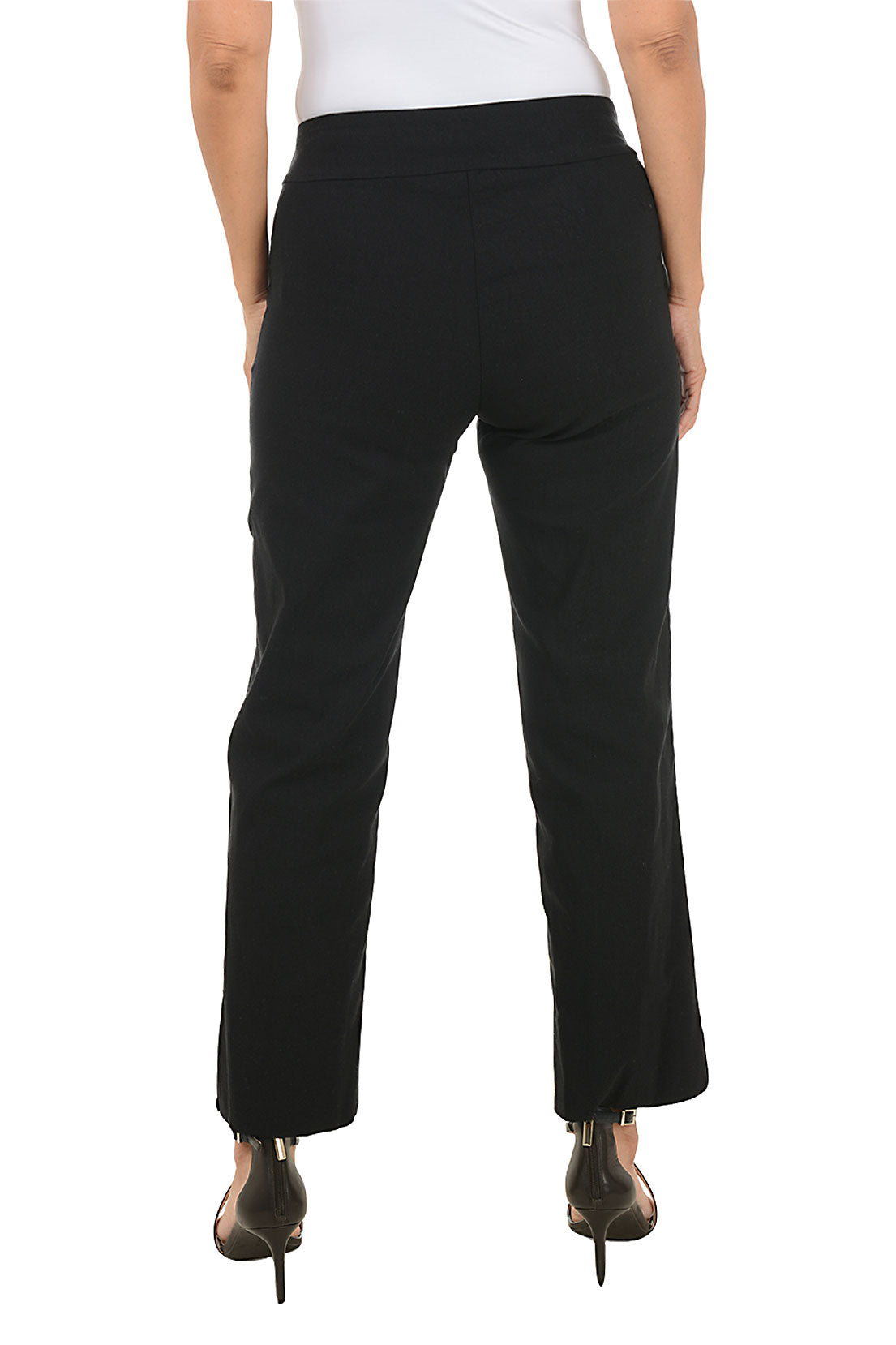 Black pants worn by a person on a white background. Back shot.