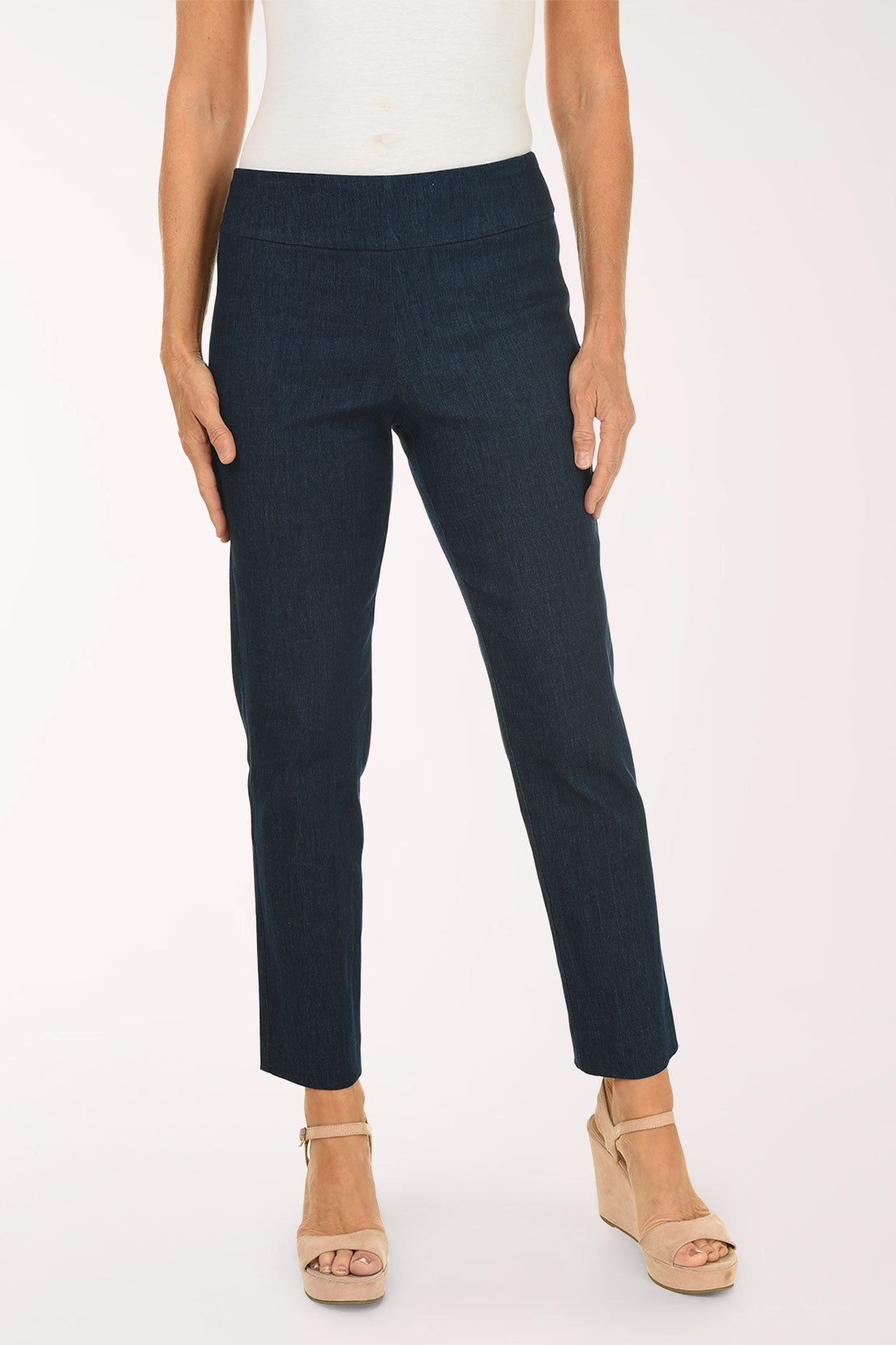 Person wearing navy blue pants on a white background