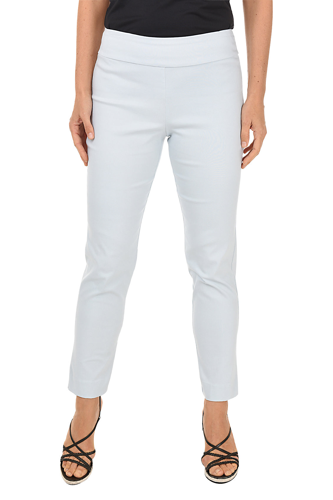 A front shot of a model wearing a white pull-on ankle pant with a black top and black heels.