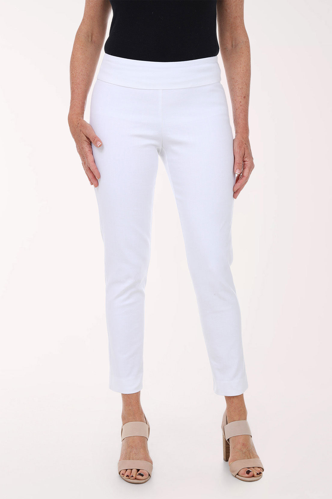 White pants worn by a person on a white background