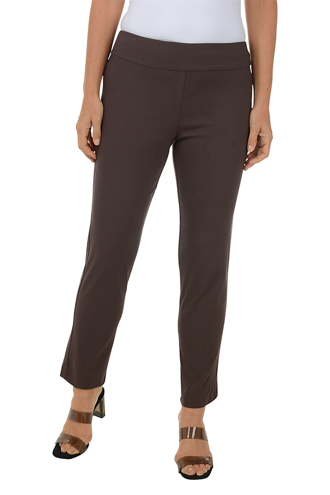 A front shot of a model wearing a brown pull-on ankle pant with a white top and beige wedges.