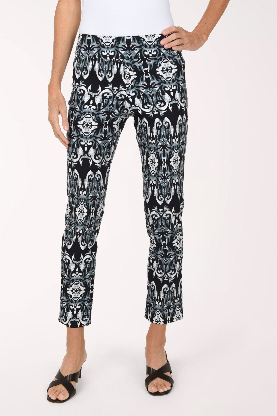 Women wearing a black mosaic printed pull-on ankle pants