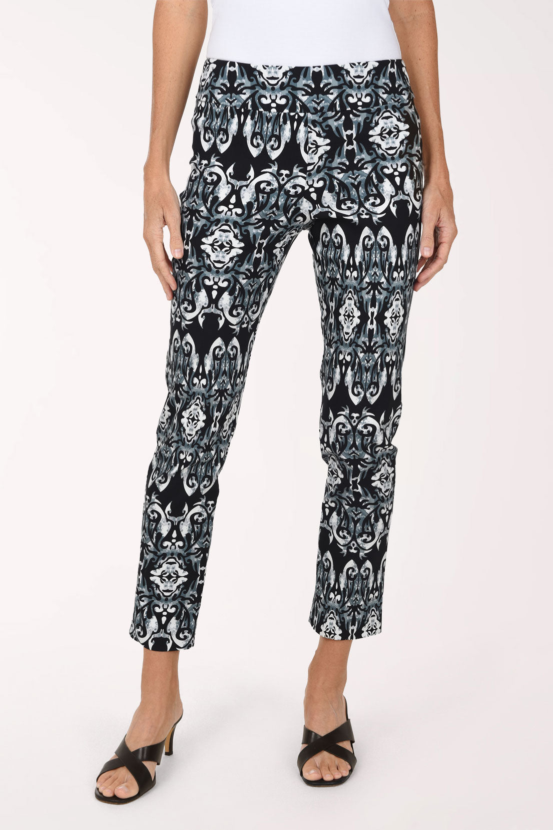 Women wearing a black mosaic printed pull-on ankle pants